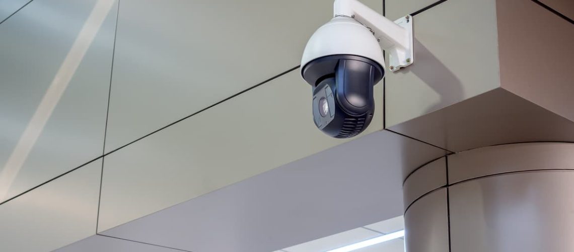 Security Camera in terminal in airport with copy space. CCTV on location, airport.